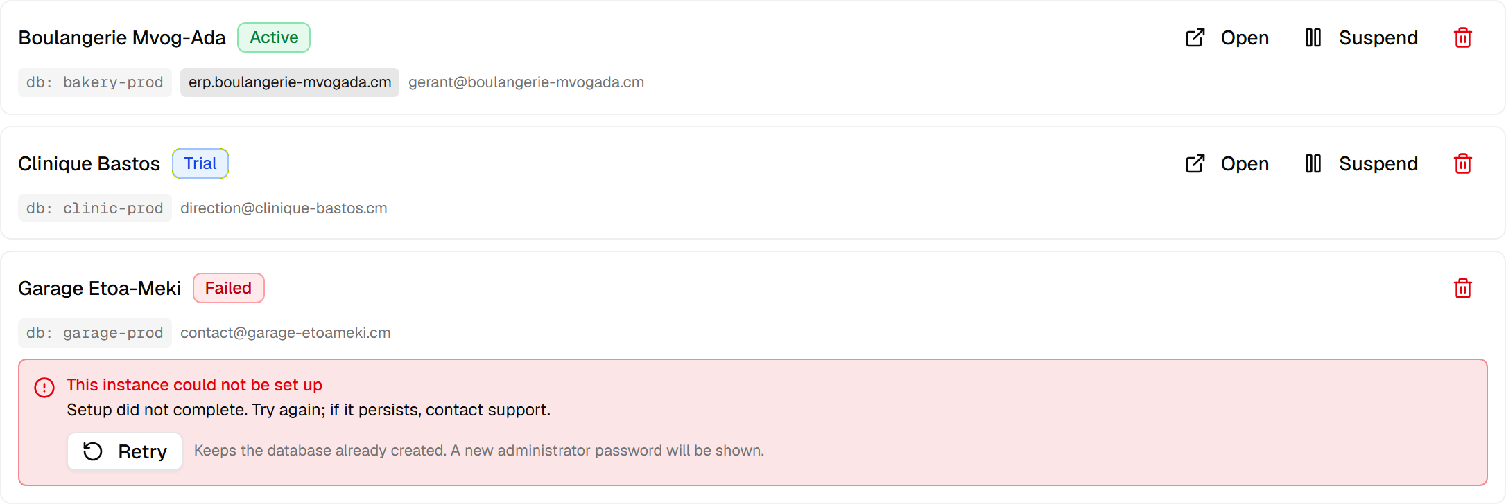 The instance list: one active on its own domain, one on trial, and one whose setup failed, showing its reason and a Retry button.